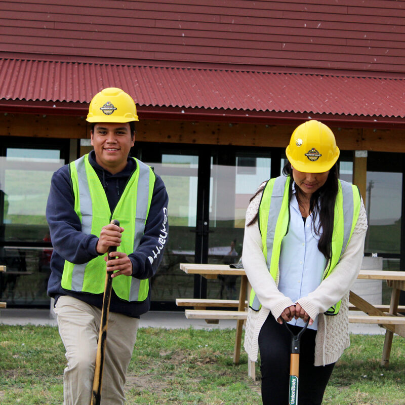 Photo by Jerome LeBeau Jr. Two people in hardhats with shovels